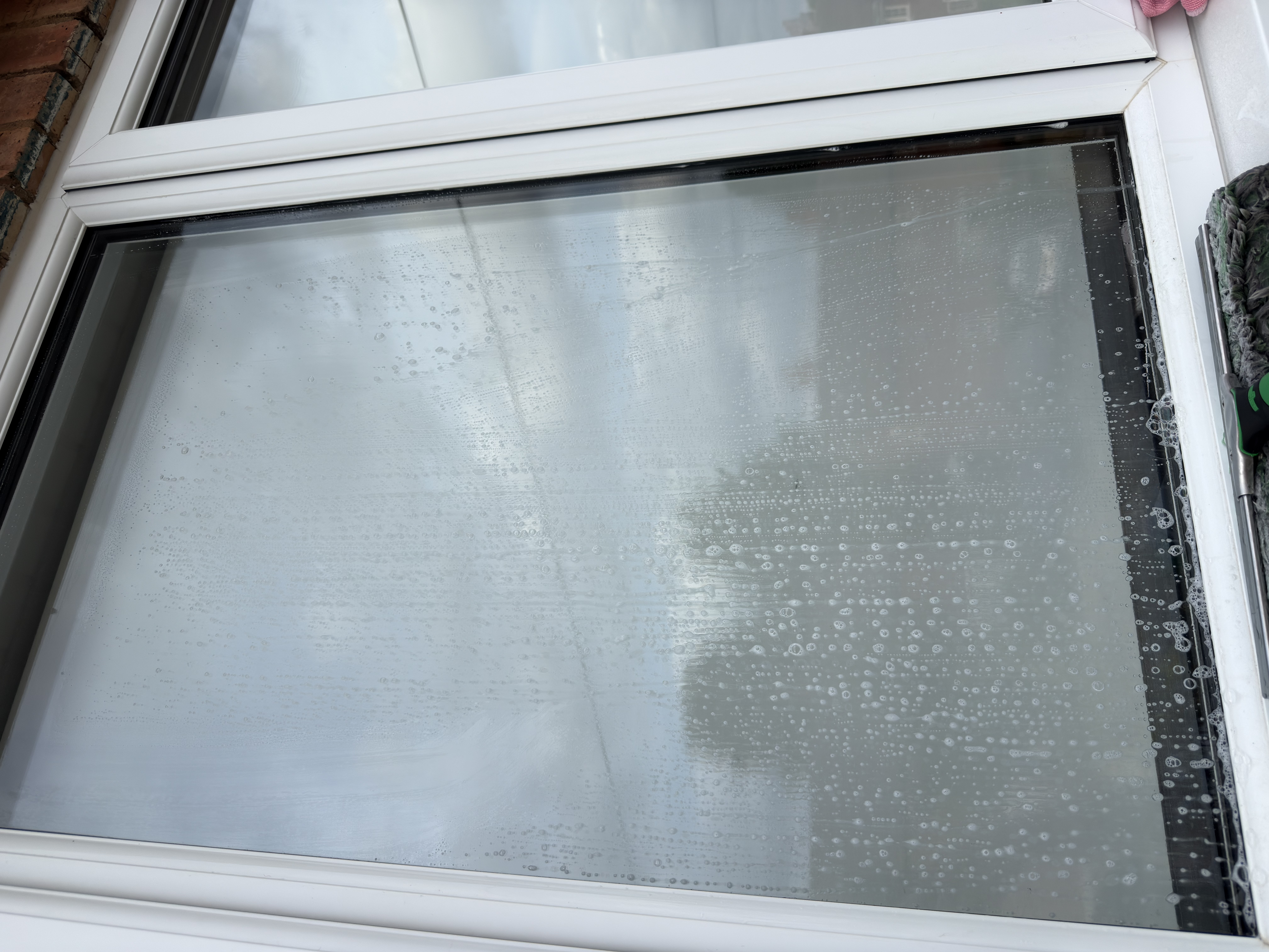 Purified water working across a window during cleaning